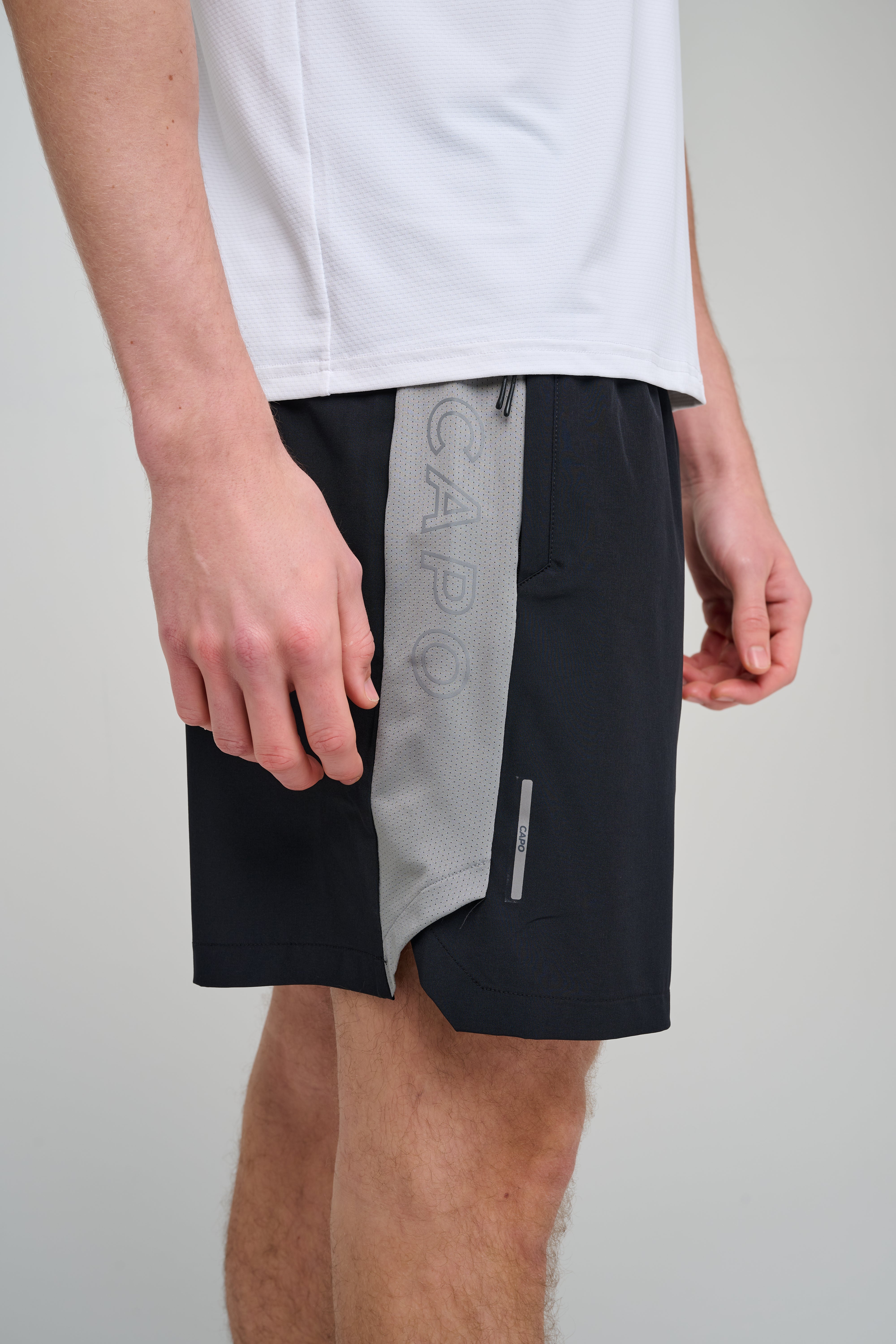 Side view of CAPO Active Performance Black Shorts